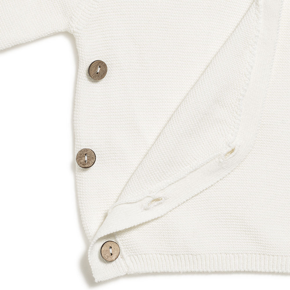 Brassière bébé en tricot écru