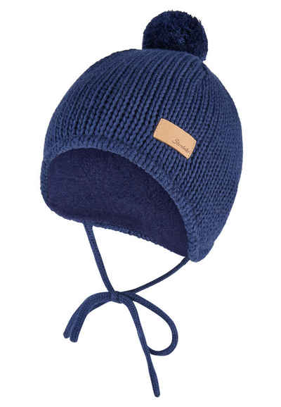 Bonnet à pompon tricoté avec cache-oreilles